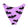 Aensland V-cut bikini bottom with playful bat print on lavender background, perfect for sunny days and stylish beach vibes.