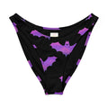 Aensland V-cut bikini bottom with playful bat design in purple and black, perfect for stylish summer days.