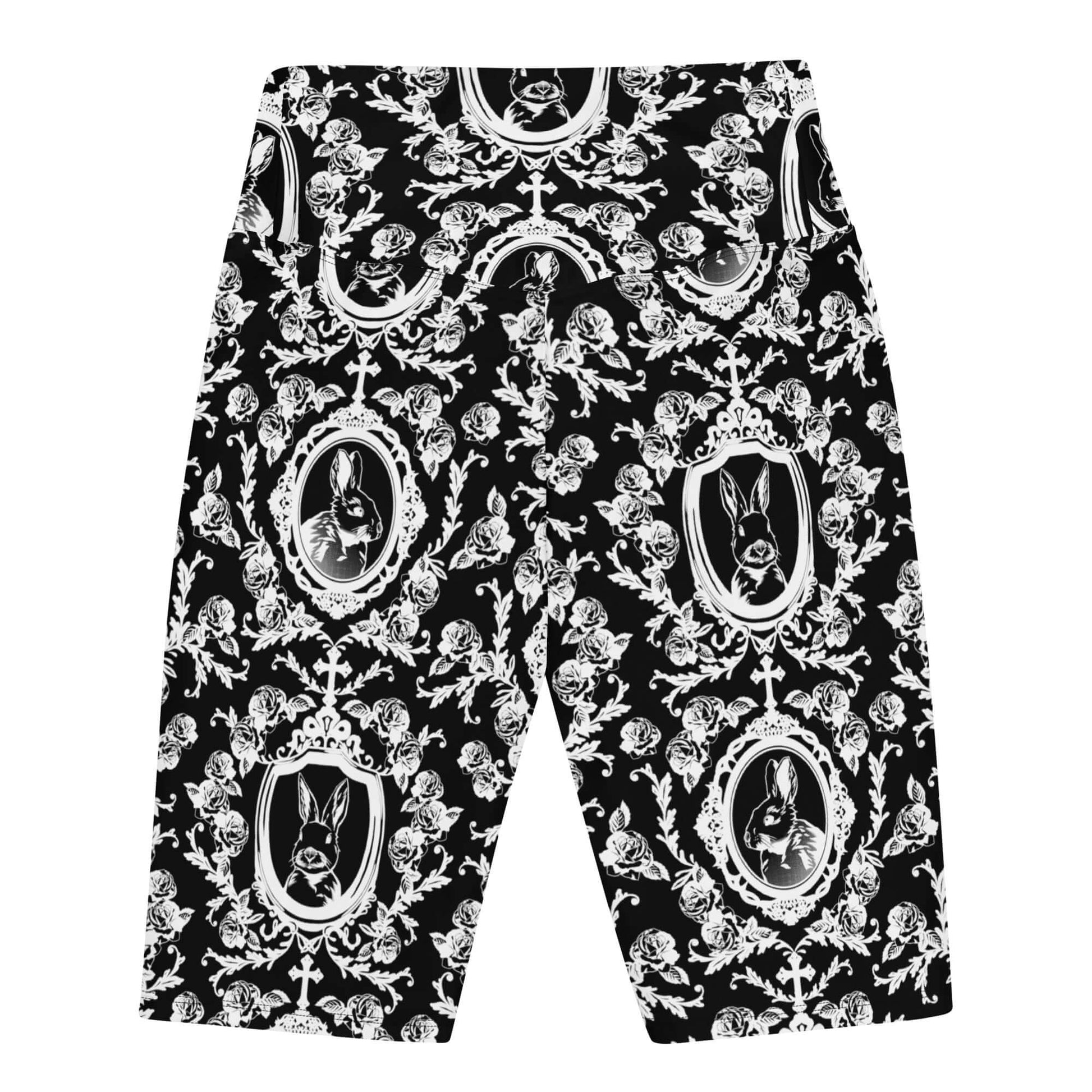 High-waisted Queen's Beloved Bunny Biker Shorts feature a stylish black and white floral pattern for versatile elegance.