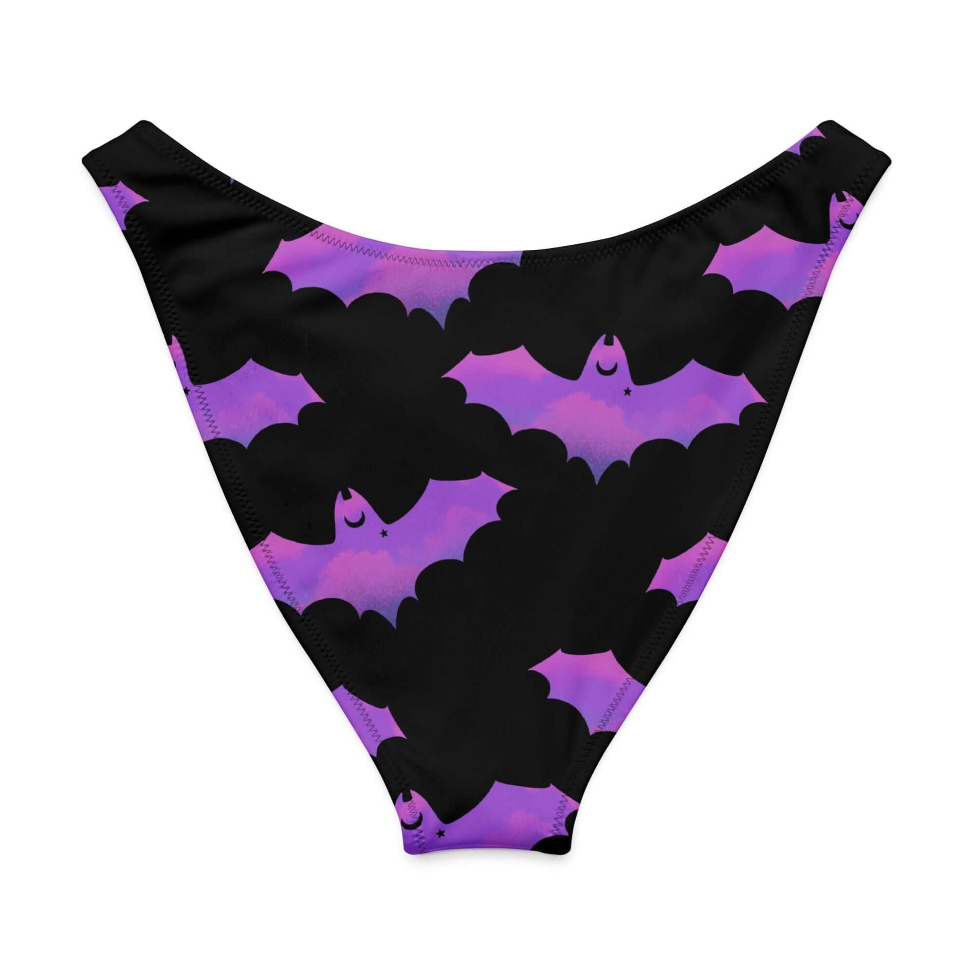 Aensland V-cut bikini bottom featuring a playful bat pattern in purple and black for a fun beach vibe.