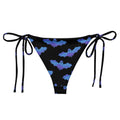 Lilith String Bikini Bottom features a playful bat print, perfect for summer sunbathing by the poolside.