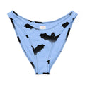 Lilith V-cut bikini bottom with playful bat print on light blue fabric, made from soft, stretchy material.