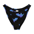 Lilith V-cut bikini bottom featuring playful bat prints on a black background with vibrant purple and blue accents.