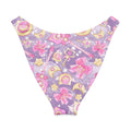 Magical Girl V-cut bikini bottom with a vibrant pattern of stars, wands, and bows against a purple background.