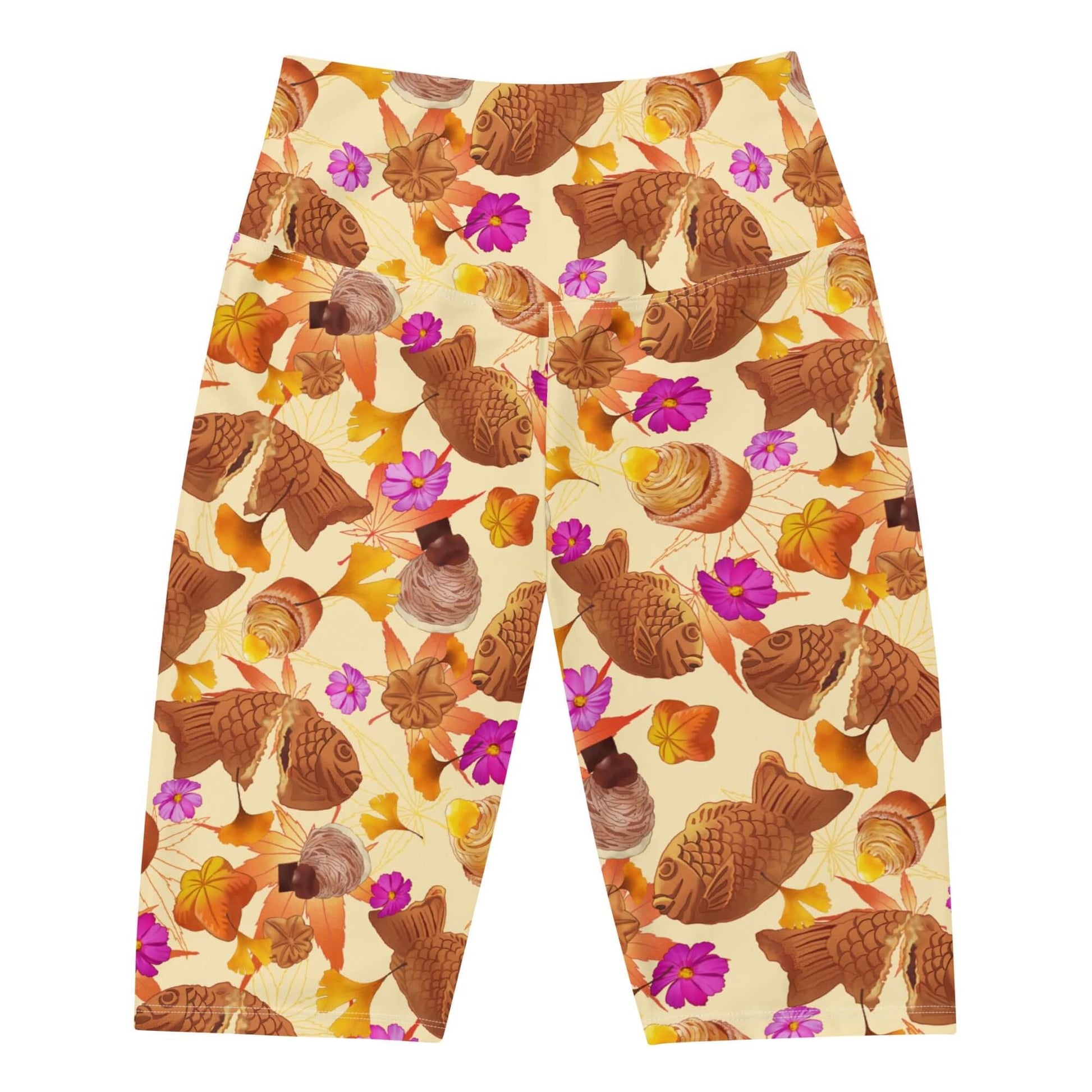 High-waisted Momiji Biker Shorts feature a vibrant autumn design, perfect for stylish fall activities.