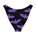 Morrigan V-cut bikini bottom featuring playful bat and cloud design in purple and black, perfect for a stylish beach day.