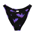 Morrigan V-cut bikini bottom featuring a playful bat print in purple and black for stylish summer vibes.