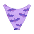 Morrigan V-cut bikini bottom in pastel purple with bat print for a stylish beach look.