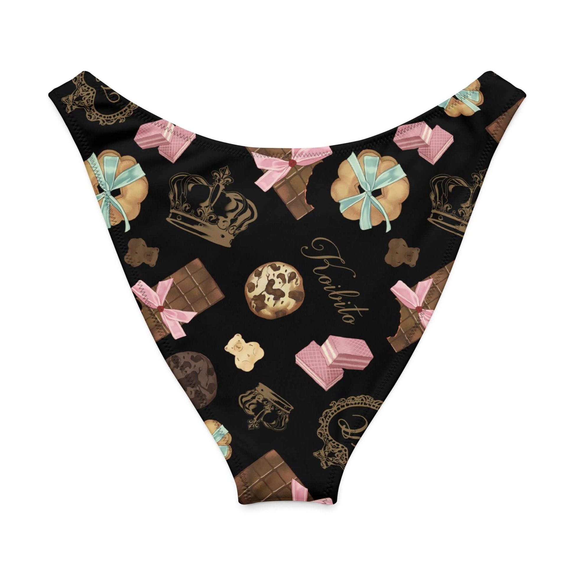 Royal Cookie V-cut bikini bottom with playful dessert design featuring crowns, chocolates, and sweets on a black background.