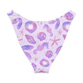 V-cut bikini bottom featuring whimsical sea shell and seahorse designs in pastel purple shades.