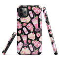 Stylish Strawberry iPhone® Tough Case featuring a fun dessert pattern in pink and black for ultimate phone protection.