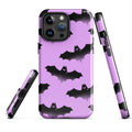 Stylish Aensland iPhone® Tough Case featuring a durable design with bats on a purple background for ultimate protection.