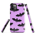 Stylish Aensland iPhone® Tough Case featuring a durable design with bats on a purple background for ultimate protection.