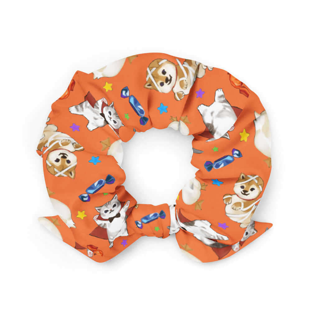Bright orange Trick or Treaters Scrunchie with cute animal designs, perfect for Halloween style and fun.