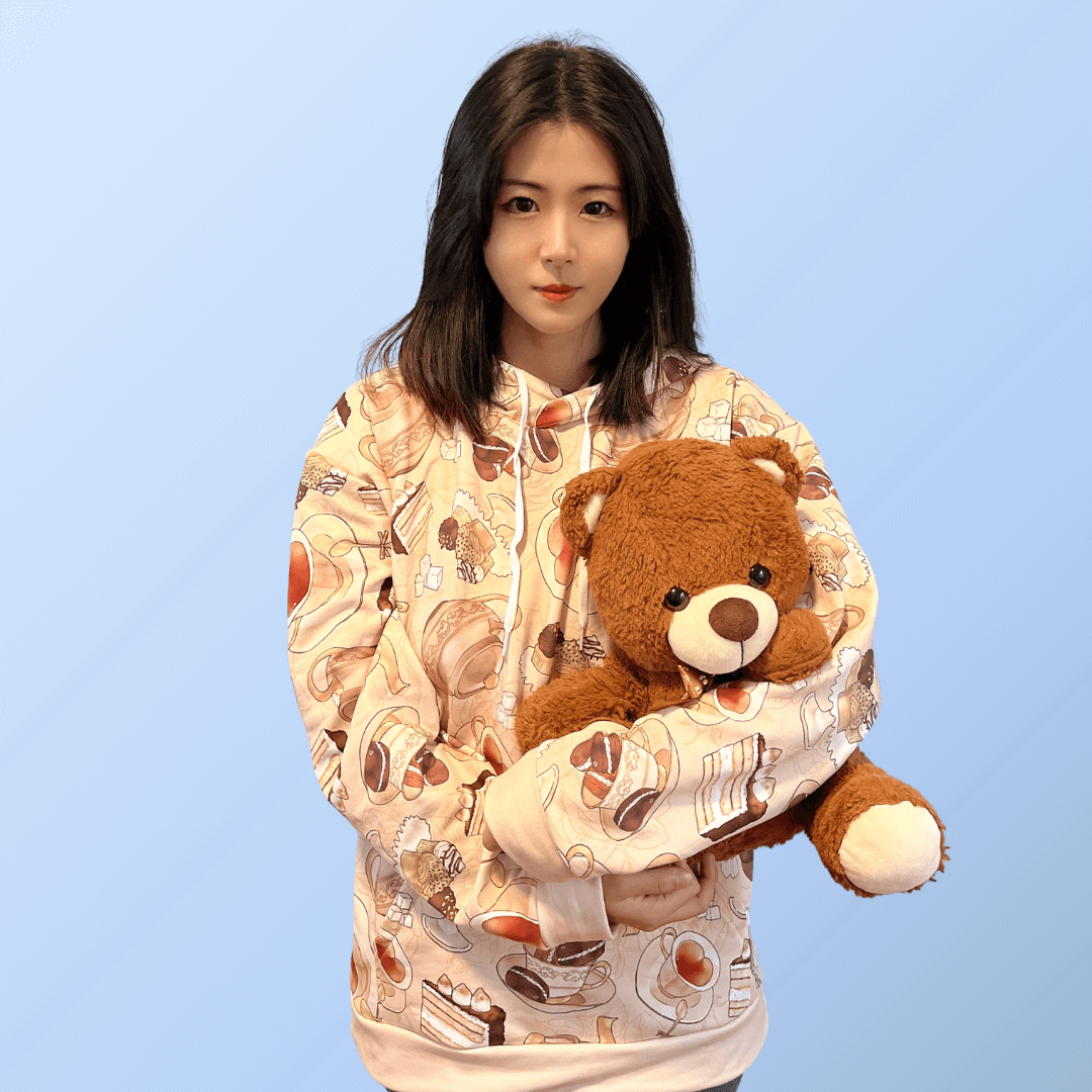 Cozy up in the stylish Café Hoodie featuring delightful pastry prints for a warm, cheerful look. Perfect for any outing!
