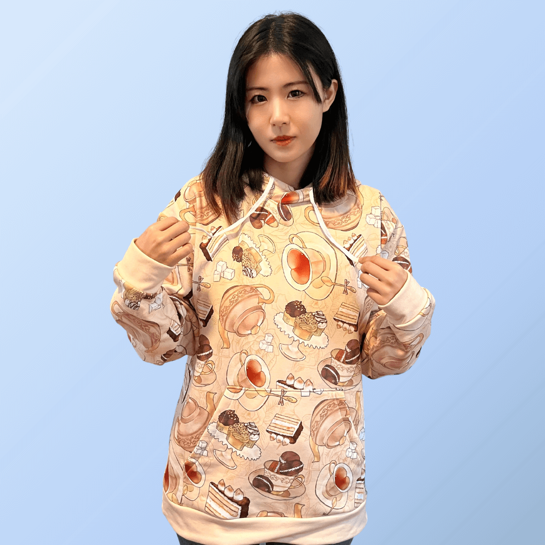 Cozy up in the Café Hoodie, featuring a vibrant print of pastries and warm drinks for a stylish, relaxed fit.