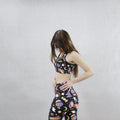 Stylish Halloween Treat Sports Bra featuring spooky designs, perfect for workouts at [STORE NAME]. Stay dry and festive!