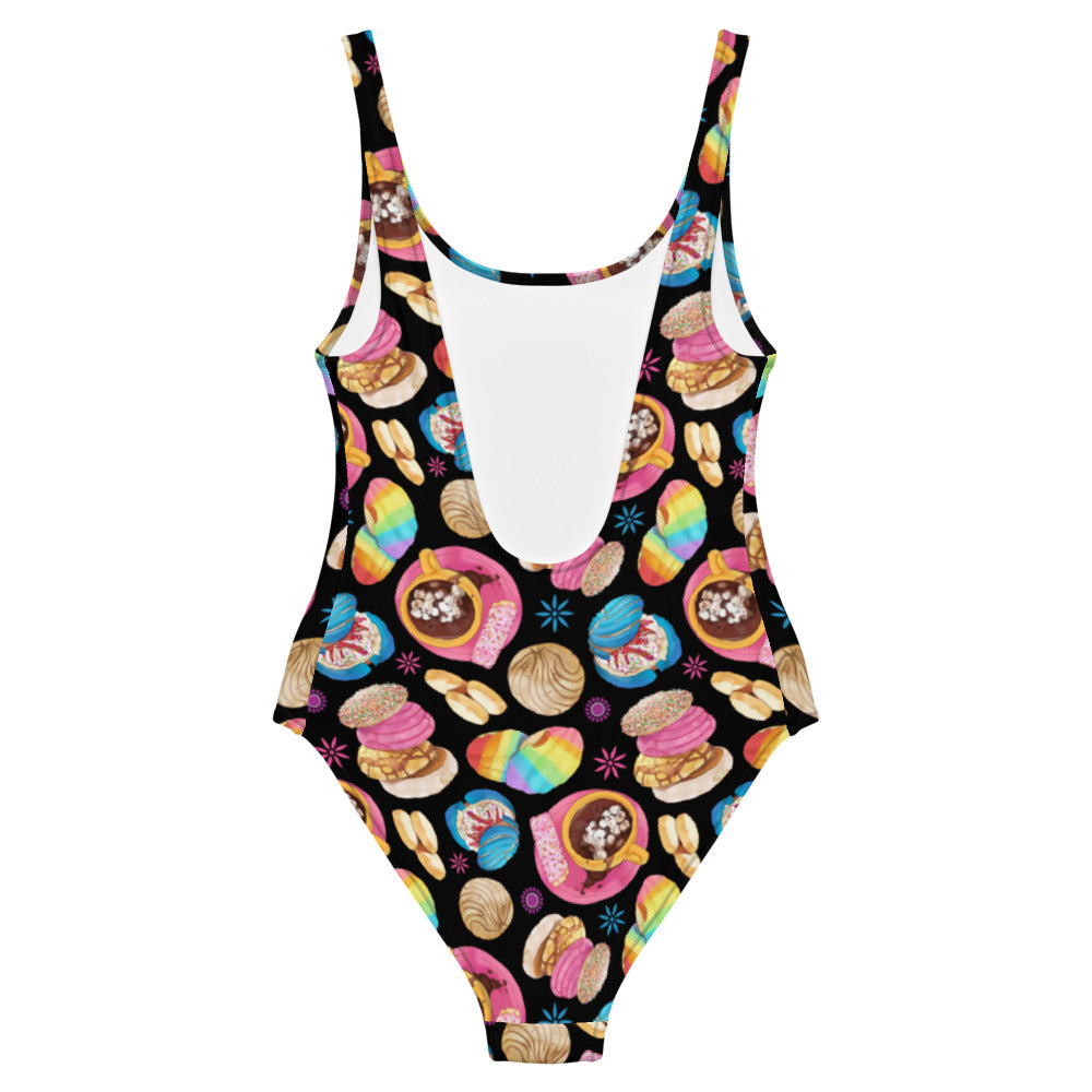 Colorful Pan Dulce One-Piece Swimsuit featuring a fun dessert print, perfect for your summer pool outings.