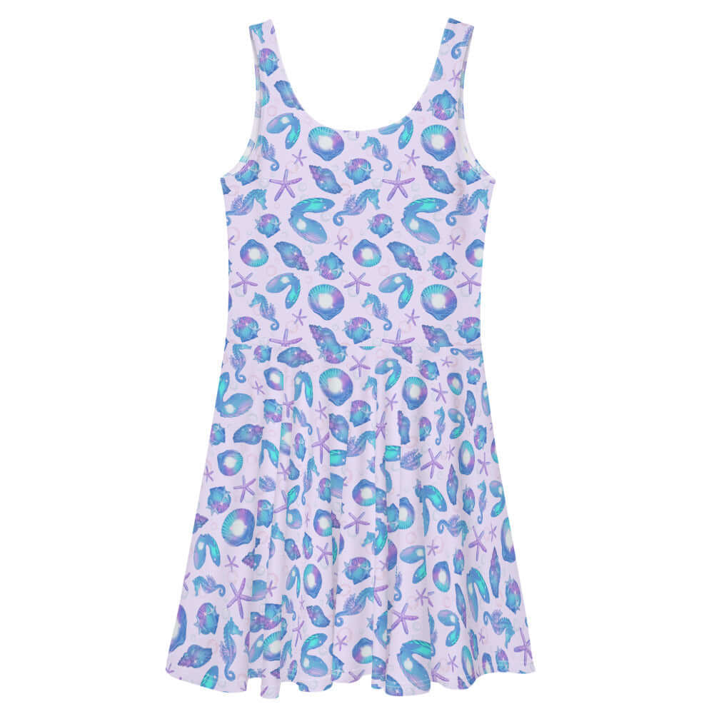 The Sea Princess Skater Dress features a vibrant seashell print, perfect for summer outings and beach days.