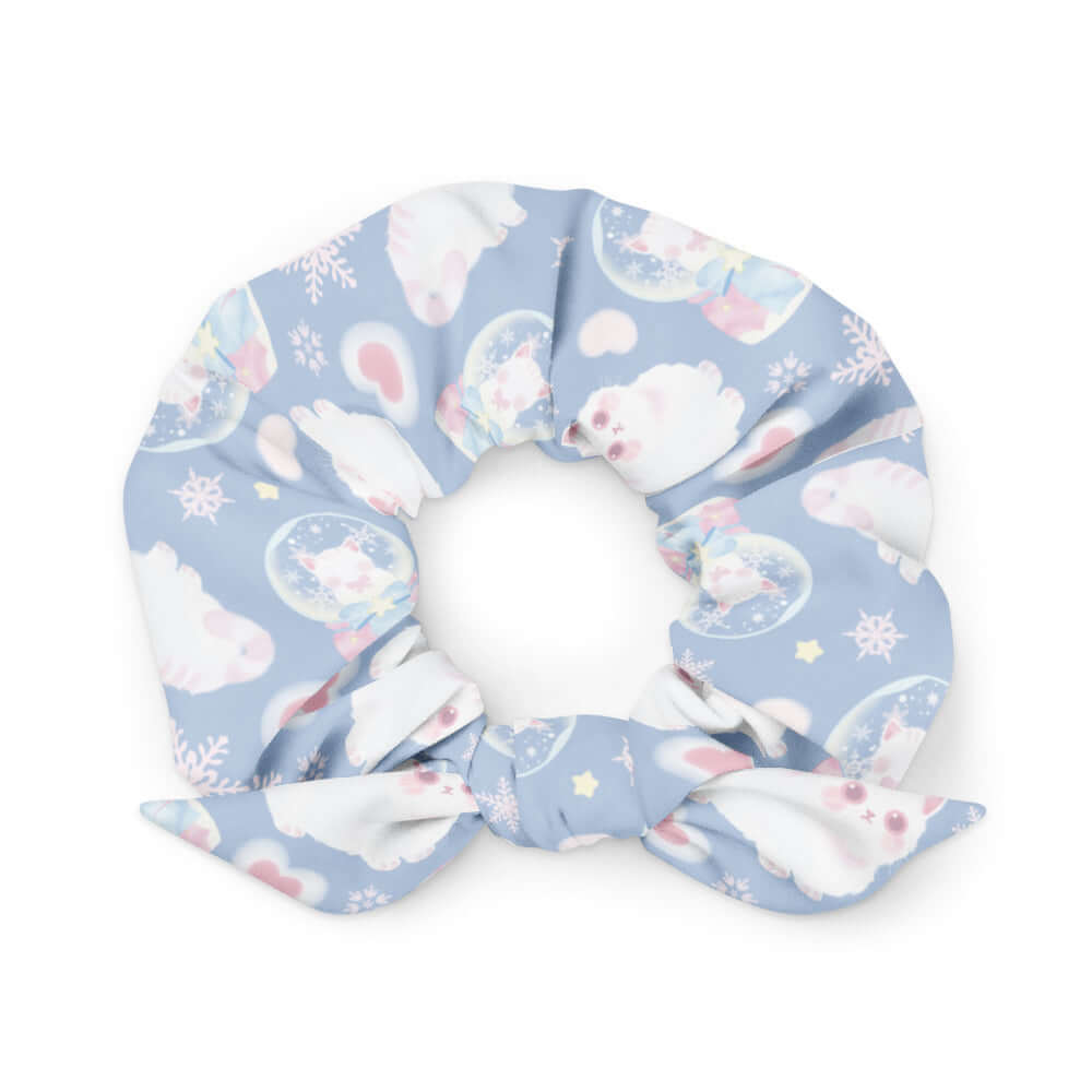 Snow Kitten Scrunchie features adorable kittens on a pastel blue background, perfect for a stylish touch to any outfit.