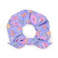 Colorful Space Scrunchie featuring vibrant planets and rockets, perfect for adding style to your outfit.
